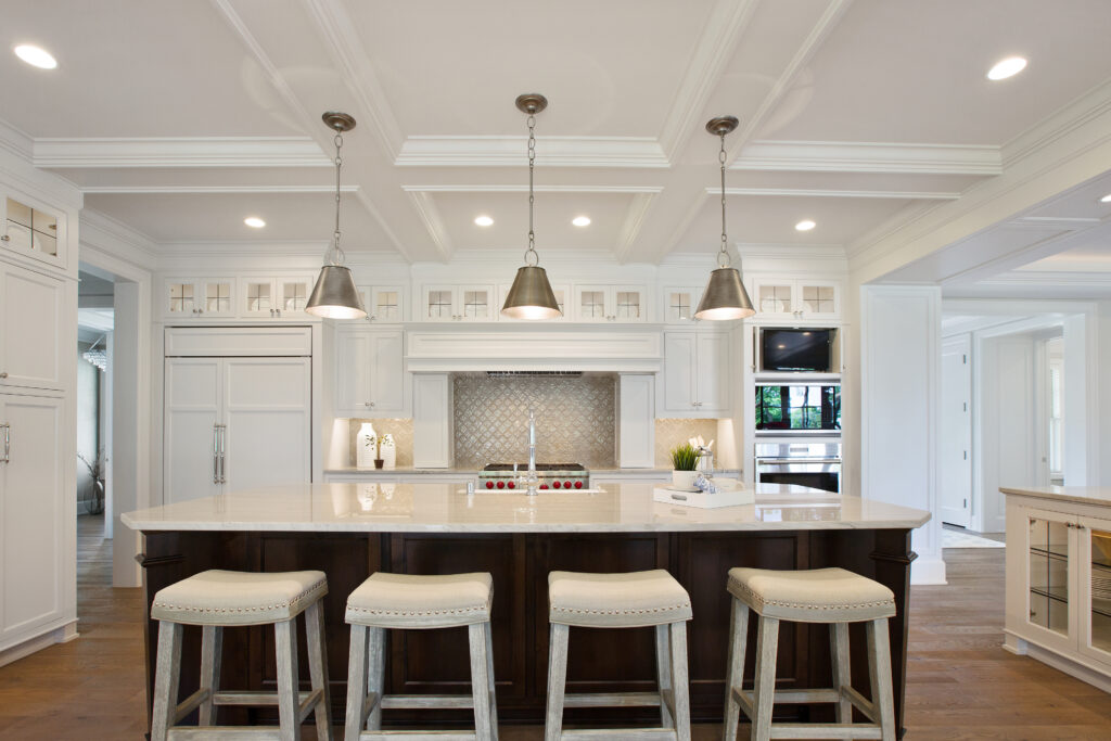 Home lighting installation in Toronto kitchen showing layered ambient, task, and pendant lighting.