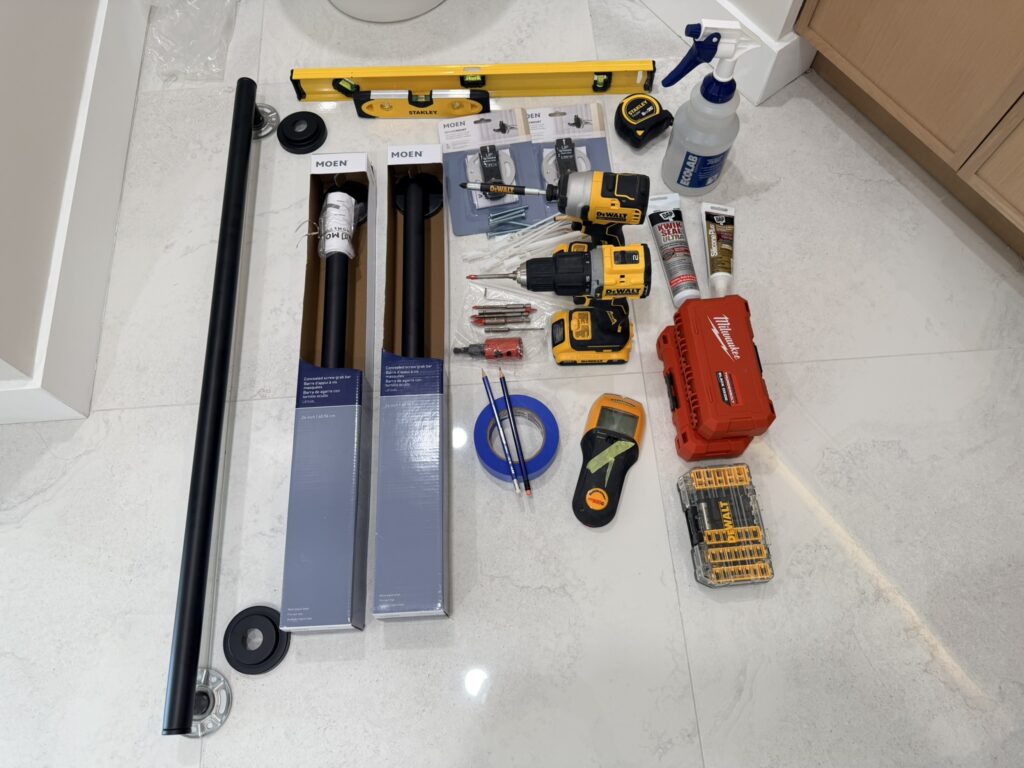 Tools and hardware used for grab bar installation in Toronto including anchors, drill bits, and mounting equipment