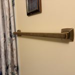Bronze bathroom grab bar installed beside bathtub for safety and accessibility in Toronto