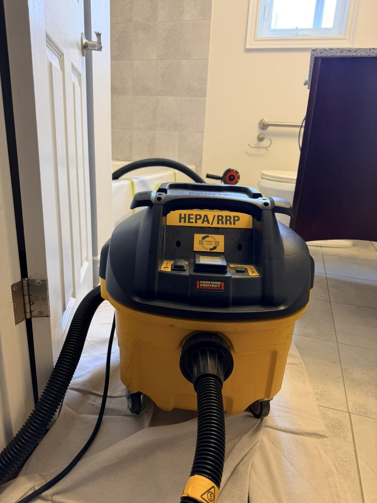 HEPA dust control system used during a bathtub cutout installation in Toronto
