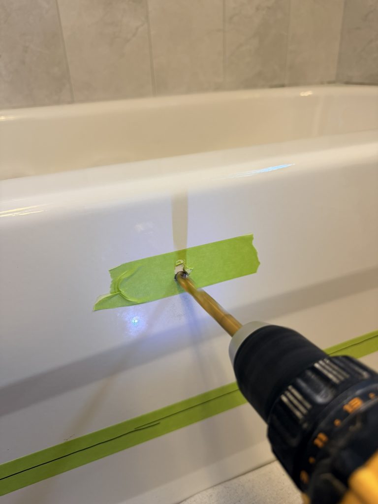 Pilot hole inspection before a steel bathtub cutout installation in Toronto