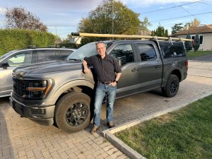 Jesse Black-Allen of Good Company beside his renovation work truck in Toronto
